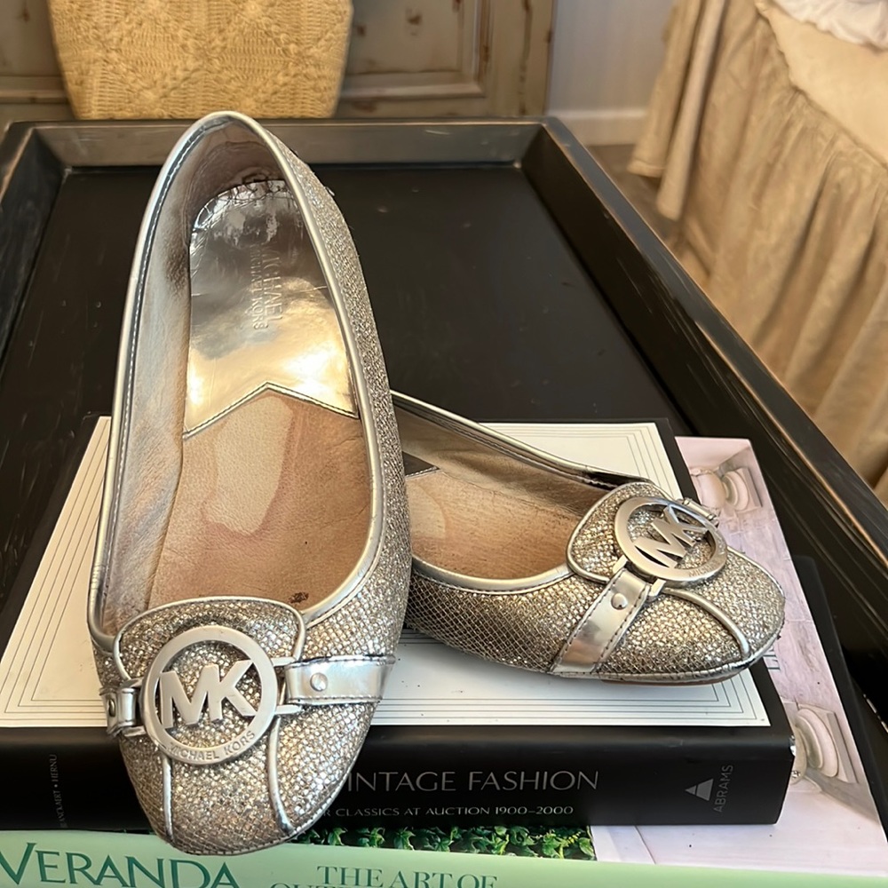 Michael Kors silver ballet flats.